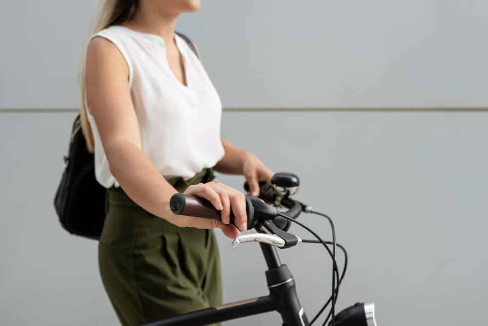 close up woman holding bike handlebars 1